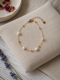 Bracelet avec perles blanches