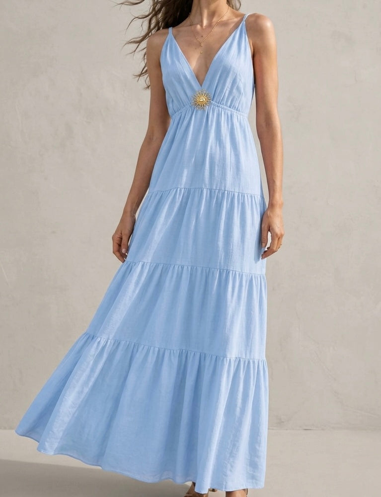 Robe longue jaune citron avec broche soleil